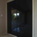 Frameless Sliding Wardrobe Doors Black Glass Finish